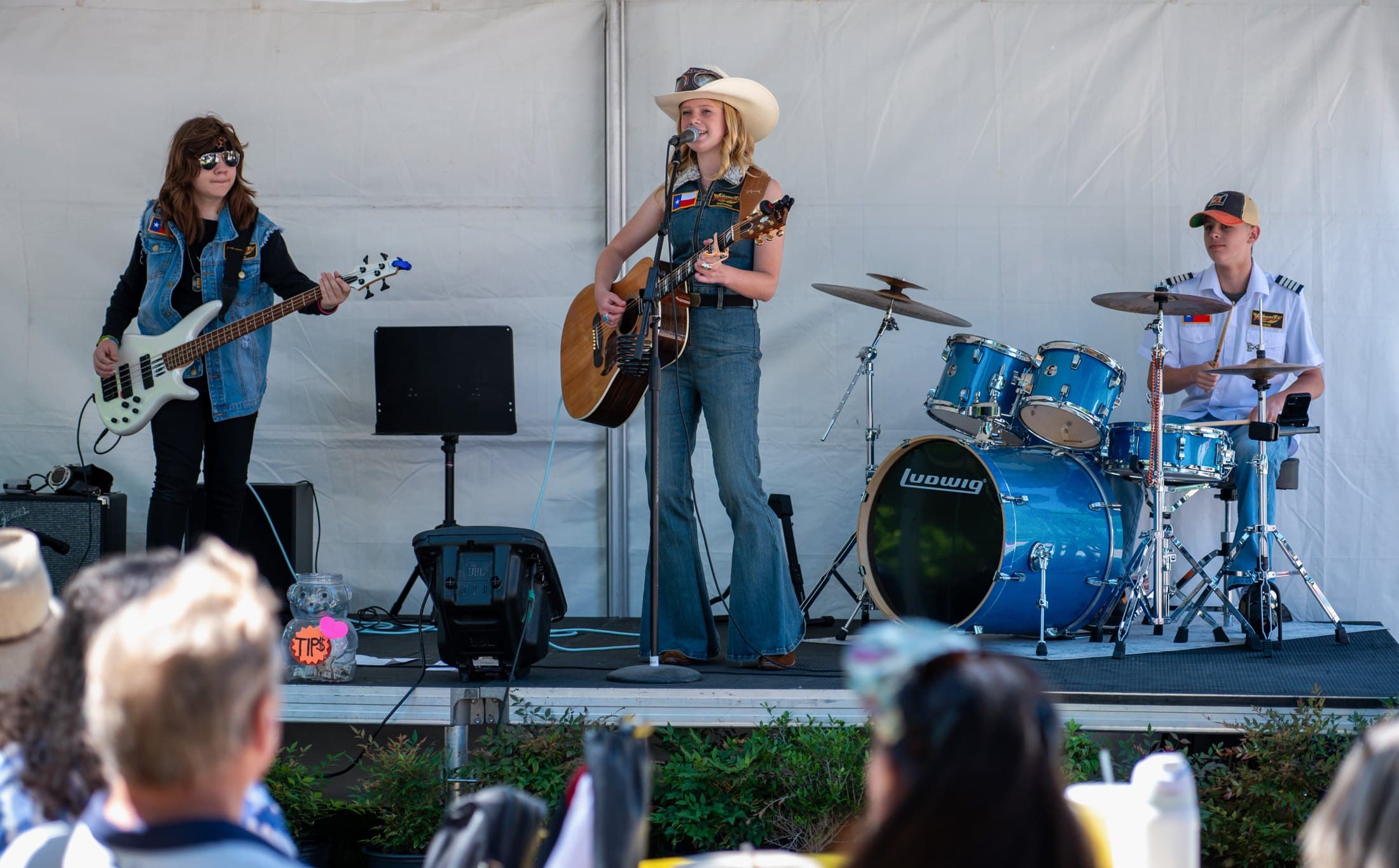 Airbourne Tex on stage at the Cottonwood Art Festival in Richardson in May 2026. From left: Jaxton Weatherly, Maryanne Hilton and Lucas Rehl. Photo: Zoe Trewin