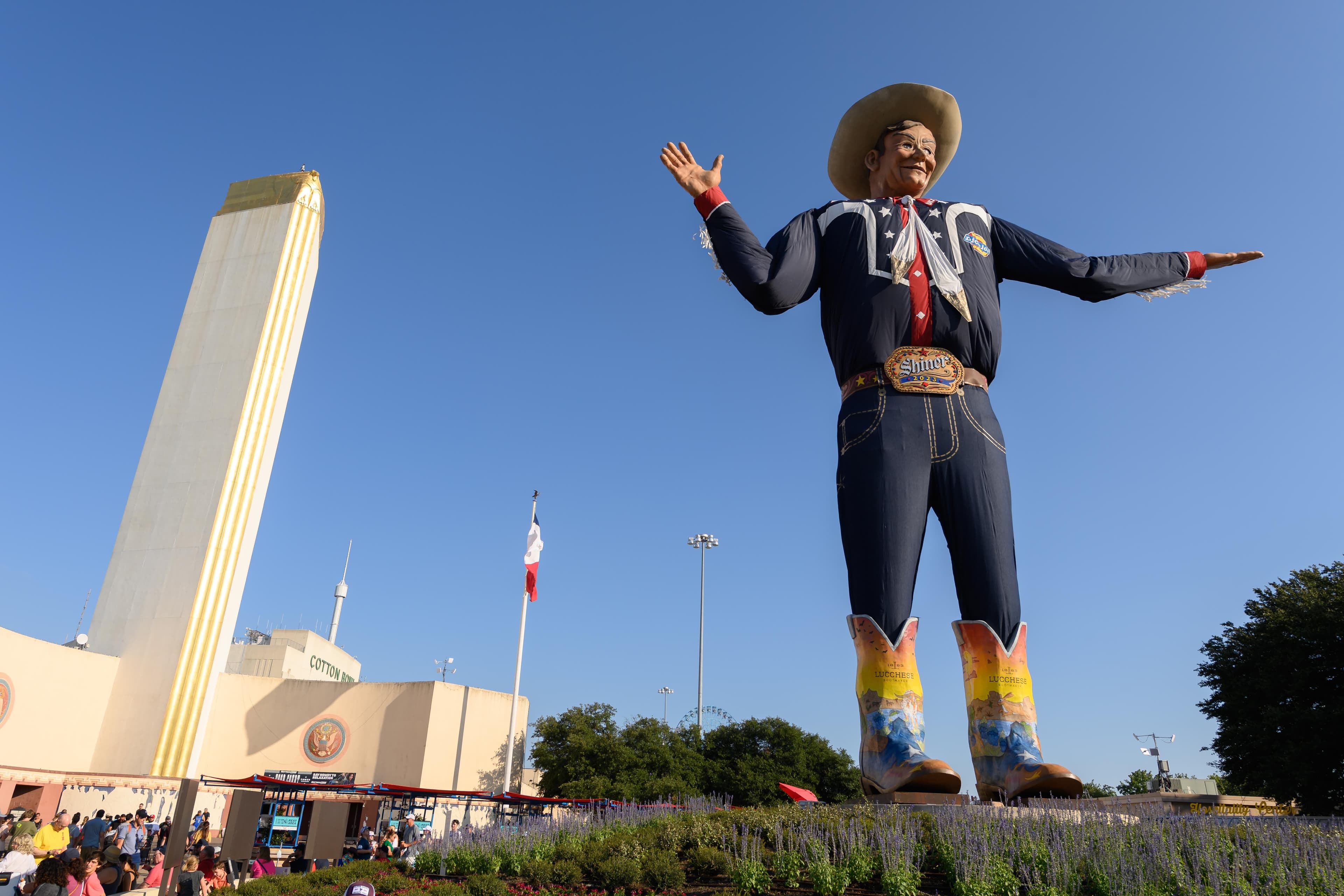 File photo: Big Tex stands beside the Tower Building at Fair Park.